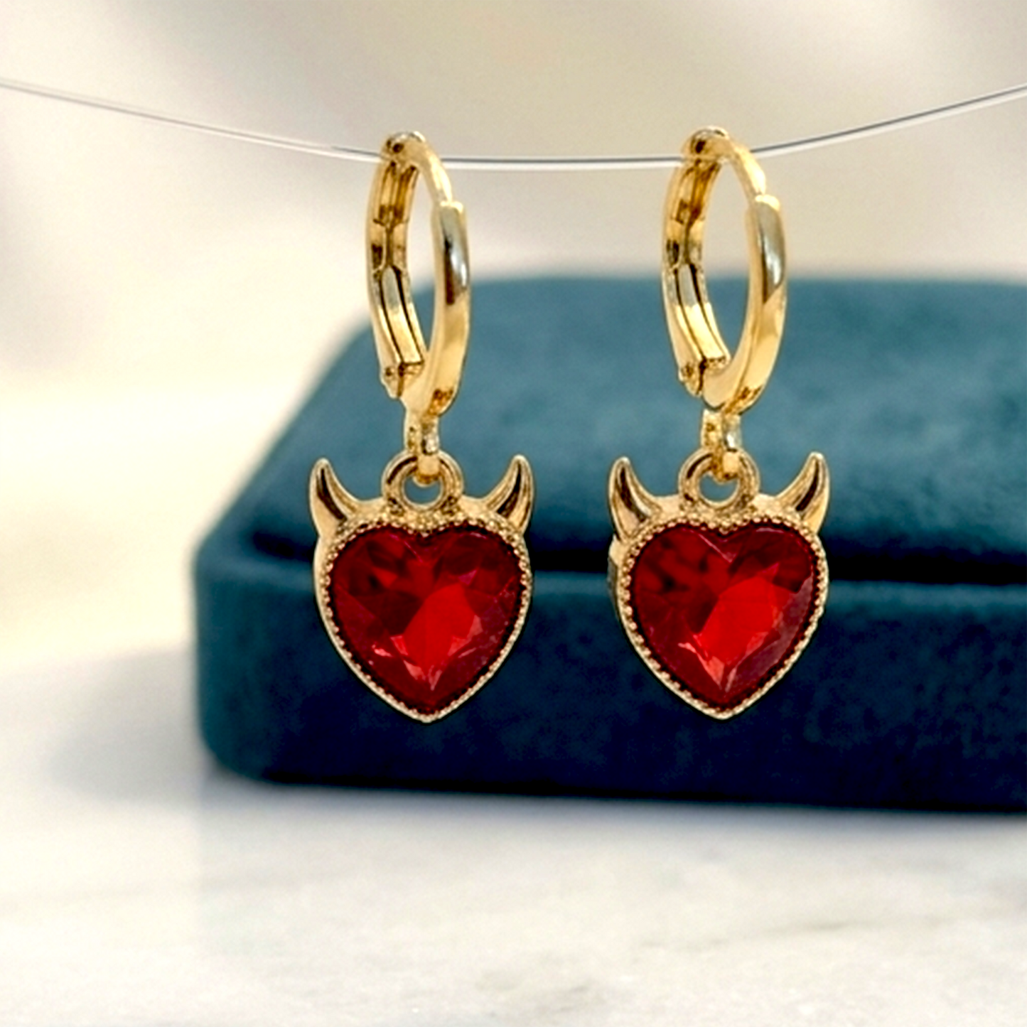Radiant & Edgy Celestial Collection – Golden Plated Anti-Tarnish Huggies | Ruby Red Devil Heart & Crystal Sunburst Earrings
