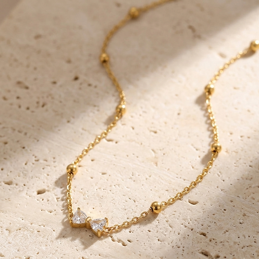 Premium Gold Crystal Bow Station Necklace | Geometric Ribbon Cut Pendant Polished Bead Statement Choker for Women