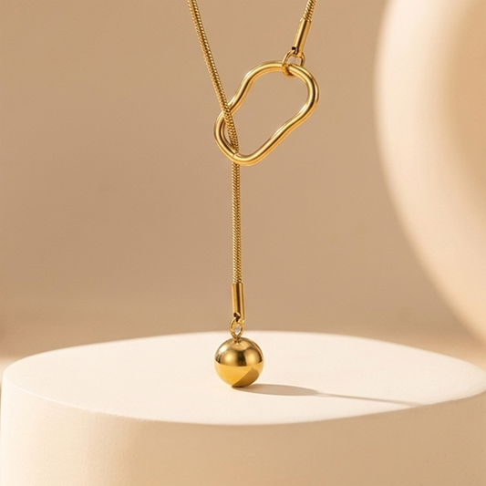 A sleek, waterproof and anti-tarnish gold lariat necklace designed for effortless, everyday elegance