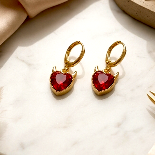 Radiant &amp; Edgy Celestial Collection – Golden Plated Anti-Tarnish Huggies | Ruby Red Devil Heart &amp; Crystal Sunburst Earrings